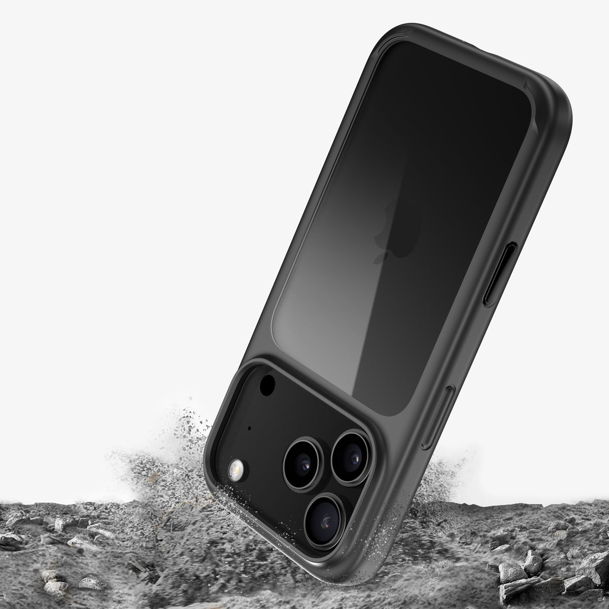 Téléphone en coque ONE noire plongeant dans du gravier, poussière soulevée à l'impact